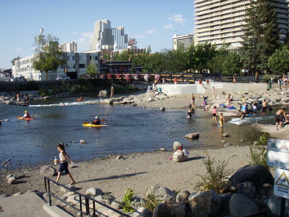 Wingfield Park on the Truckee River in downtown Reno, Nevada.  Formerly a derelict site, this reach of river was transformed into a popular recreational area, serving a wide demographic.  (photo by Matt Kondolf)